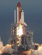 photograph of the space shuttle lifting off from its launch pad