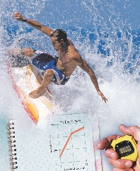 photograph of a young man riding a surfboard on a wave