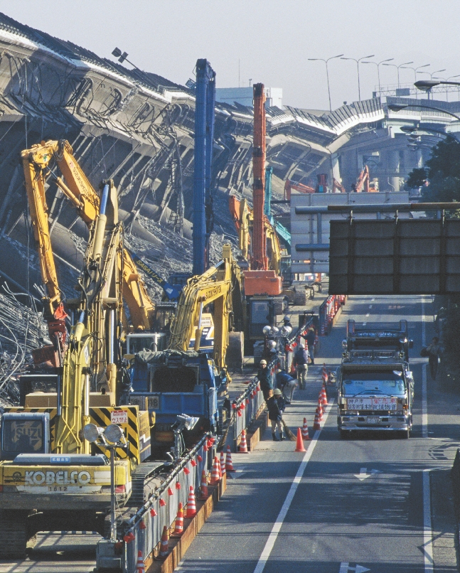 photograph of earthquake destruction along a city street