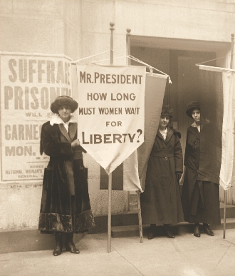 Women protest near the White House in 1917.