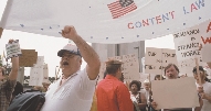 photograph of a group of people at a protest rally