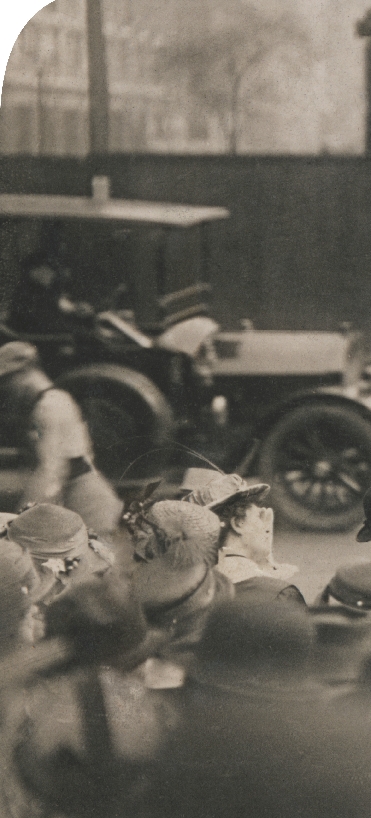 photograph of women protesters and old time car from the early 1900s