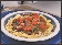 photograph of a plate of spaghetti and meatballs