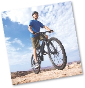 photograph of a young man on a mountain bike