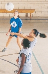 photograph of girls playing basketball in a gym