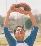 photograph of a boy catching a baseball