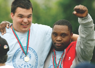 photograph of two Special Olympics medal-winning athletes