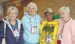 Delores “Snooky” Doyle, Shirley Burkovich, and Delores “Pickles” Dries meet Honorary Member Mamie “Peanuts” Johnson at the All-American Girls Professional Baseball League Reunion in 2006.