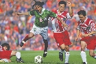 photograph of a group of male soccer players on a soccer field