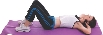 photograph of a woman lying on her back on an exercise mat