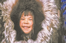 A thick coat keeps this Alaskan girl warm.