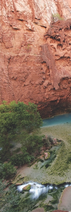 A photograph of a range of rocks that face the water body below