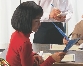 photograph of a woman reading a restaurant menu