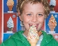 photograph of a boy eating an ice cream cone