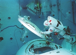 This astronaut practices underwater. Outer space can feel like being underwater.