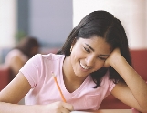 photograph of a girl writing