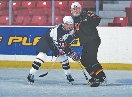 photograph of two hockey players in an ice rink