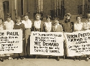 photograph of women suffragettes of the early 1900s holding signs