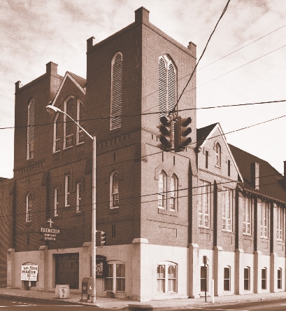 photograph of a church building on a street corner