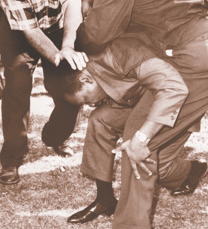 Chicago, Illinois, August 5, 1966. Fellow protesters help Martin after he was hit by a rock during a march.