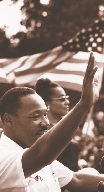 photograph of Martin waving with the United States flag in background