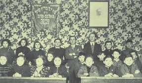 photograph of children in a classroom from before the war