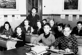 photograph of Jewish students wearing star patches in a classroom