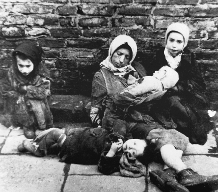 photograph of a homeless Jewish woman and four children on a street