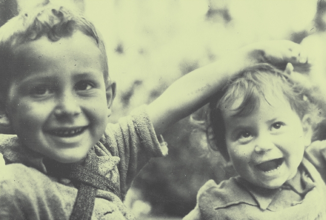 photograph of a little boy and girl