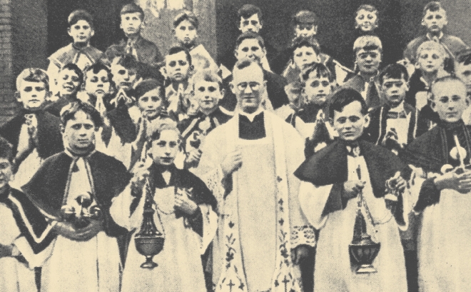 photograph of a group of young men dressed in priest's robes