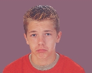 photograph of a boy's face frowning