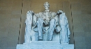 Photograph of a carving in stone of a man (Abraham Lincoln) sitting