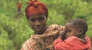 Photograph of a woman holding a very young boy