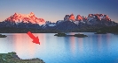 Photograph of a lake with no waves and a red arrow pointing to the surface