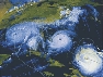 Photograph of three hurricane systems as seen from high above them