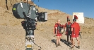 Illustration of a movie camera and actors on location