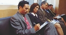 Photograph of a man filling out an application on a clipboard