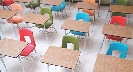 Photograph of empty desks in a classroom