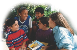 Photograph of a small group of teenagers talking