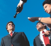 Photograph of news reporters interviewing a man