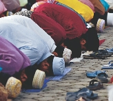 Photograph of people praying