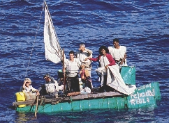 Photograph of people on a makeshift raft