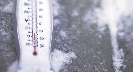 Photograph of a thermometer with snow around it