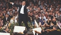 Photograph of a conductor leading an orchestra