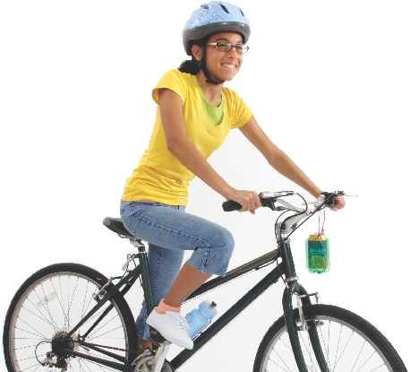 Photograph of girl on her bicycle with cup holder attached to handlebar