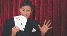 Photograph of a magician doing a card trick