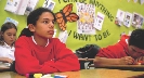 Photograph of students at their seats in a classroom listening attentively