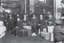 Italian immigrants wait in line at Ellis Island in New York Harbor, 1905.