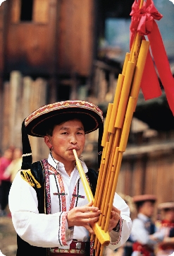 A Hmong musician plays at a spring festival in China.