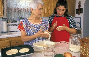 Immigrant families often prepare traditional meals at home. They pass on cultural traditions from one generation to the next.